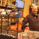 Photos by Karina Andrew/Whidbey News-Times
Above, Ryan Prichard mans the counter at Whidbey Wonkas Chocolate Co., his new business on Pioneer Way. 	Below, Prichard plays the guitar in the shop.