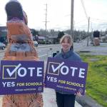 A student and a dinosaur were among those who campaigned for the school bond measure.