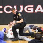 Photos by Rachel Rosen/Whidbey News-Times
Captain Craig Anderson demonstrates how to stop bleeding on middle schooler Matthew Graham.