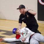 Photos by Rachel Rosen/Whidbey News-Times
Captain Craig Anderson demonstrates how to stop bleeding on middle schooler Matthew Graham.