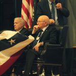 Photo by Karina Andrew/Whidbey News-Times
Bill Reeder, standing, Bill Wilson, left, and Joe Crecca share their experiences as prisoners of war in the Vietnam War at a symposium at Naval Air Station Whidbey Island March 16.