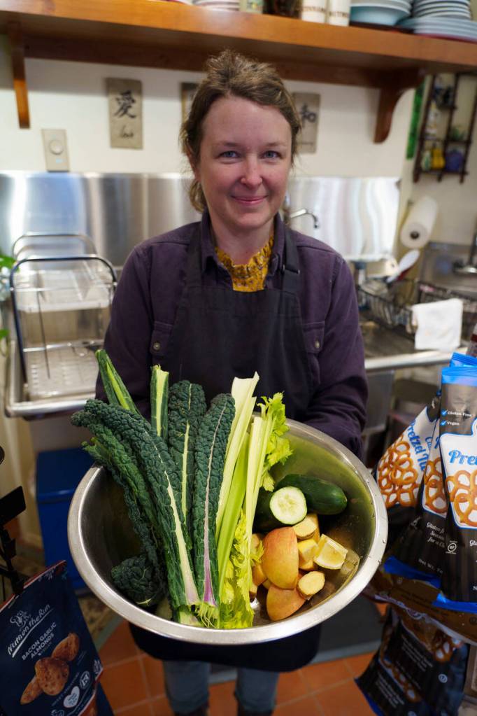 Photos by David Welton
Employee Jennifer Adcock holds a bowl of fresh ingredients for juice.