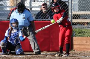 Photos by John Fisken
Coupeville High School sophomore Taylor Brotemarkle, the teams starting shortstop, takes a swing in a softball game against South Whidbey High School March 15, while South Whidbey sophomore Josalynn Jaeger-Funcannon catches.