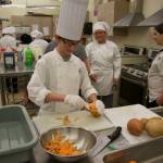 Jeremiah Statler peels a sweet potato for his dish of maple roasted sweet potatoes. (Photo by Rachel Rosen/Whidbey News-Times)