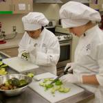 Alex Wutzke slices avocados for avocado fries with sriracha mayo, the competitions winning dish. (Photo by Rachel Rosen/Whidbey News-Times)