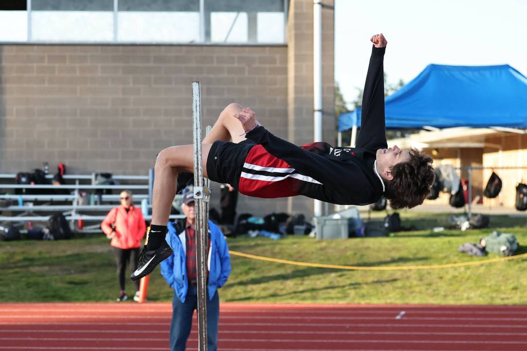 Junior Nick Guay competes in the high jump March 22 during Coupeville High Schools first home track and field meet of the season. Guay took first place in the event with a jump of 5-10. (Photo by John Fisken)