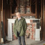 Lynn Hyde stands in the Haller House, which was recently listed in the National Register of Historic Places. (Photo by Karina Andrew/Whidbey News-Times)
