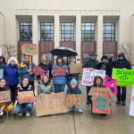 Protesters gather in front of the Island County commissioners offices in Coupeville March 24 in a move meant to prompt the elected officials to declare a climate emergency. (Photo provided)