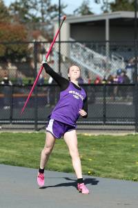 Lilly Grubbs throws a javelin at a March 19 track meet against Burlington. The Oak Harbor High School varsity girls team won 96.83 to 53.16. (Photo by John Fisken)