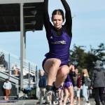Verity Merth lands a jump at a March 19 track meet against Burlington. The Oak Harbor High School varsity girls team won 96.83 to 53.16. (Photo by John Fisken)