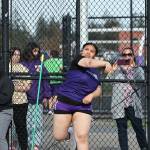 Olivia Hudson throws a shot put ball at a March 19 track meet against Burlington. The Oak Harbor High School varsity girls team won 96.83 to 53.16. (Photo by John Fisken)