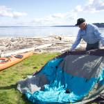Photo by Rachel Rosen/Whidbey News-Times
Bill Walker demonstrates setting up camp at Windjammer Parks water camping site.