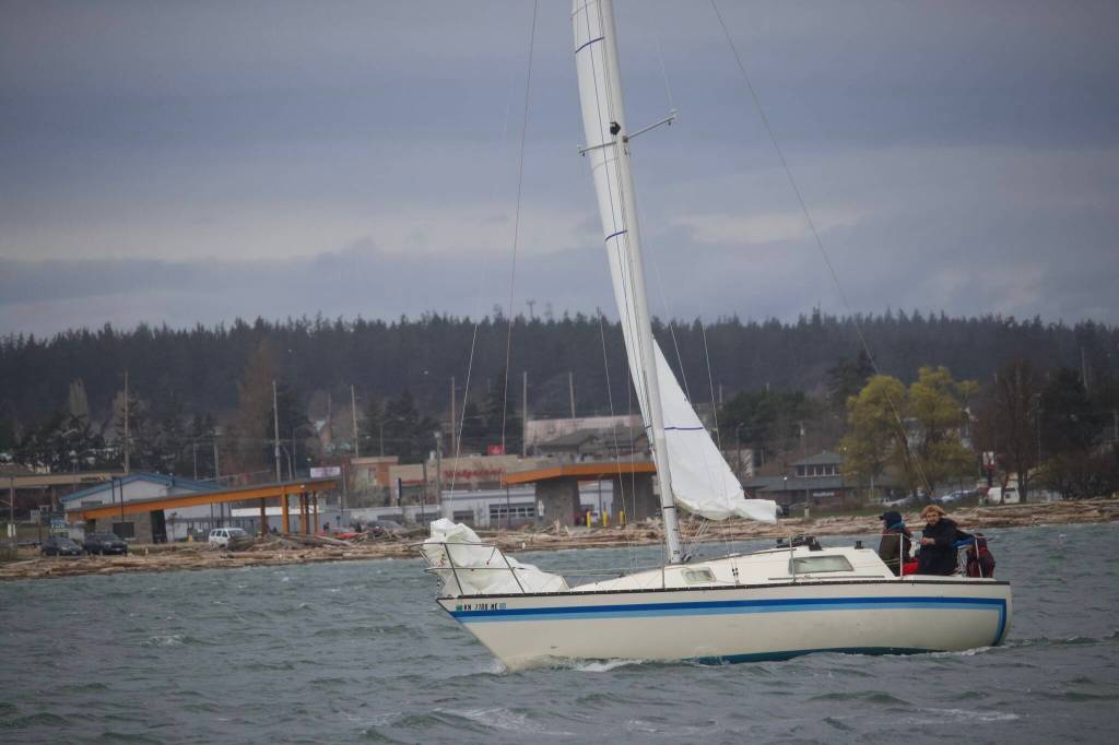 A boat participates in the Oak Harbor Yacht Clubs Frostbite Series sailboat race. (Photo by Rachel Rosen/Whidbey News-Times)
