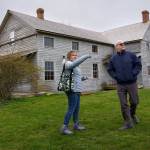 Photo by David Welton
Ebey's Landing National Historical Reserve manager Marie Shimada shows Rep. Rick Larsen around the historic Coupeville Ferry House property during a visit to the island April 6.
