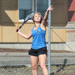 Photo by John Fisken
Junior Catie Beech of South Whidbey serves the ball during a tennis match against Coupeville on April 14. Coach Karyle Kramer said it was Beechs first time playing singles this year and her match was the highlight of the day. Even though she lost 4-6, 6-7, Beech showed mental and physical toughness. Kramer said she worked on implementing strategies and tactics and made progress even during the match. Im proud of her for persevering and not giving up, Kramer said.