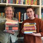 File photo by Karina Andrew/Whidbey News-Times
Meg Olson and Felix Hall show off just a few of the titles, both classic and contemporary, available at Kingfisher Bookstore in Coupeville.