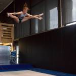 Malaina Yargo, 14, straddle jumps on a trampoline. Yargo is a national qualifier in double mini. (Photo by Rachel Rosen/Whidbey News-Times)