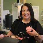Photo by Karina Andrew/Whidbey News-Times
Megan Varner-Duckett packs a gift box with her homemade candles.
