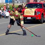 A member of Whidbey Islands rolller hockey team shoots a puck.