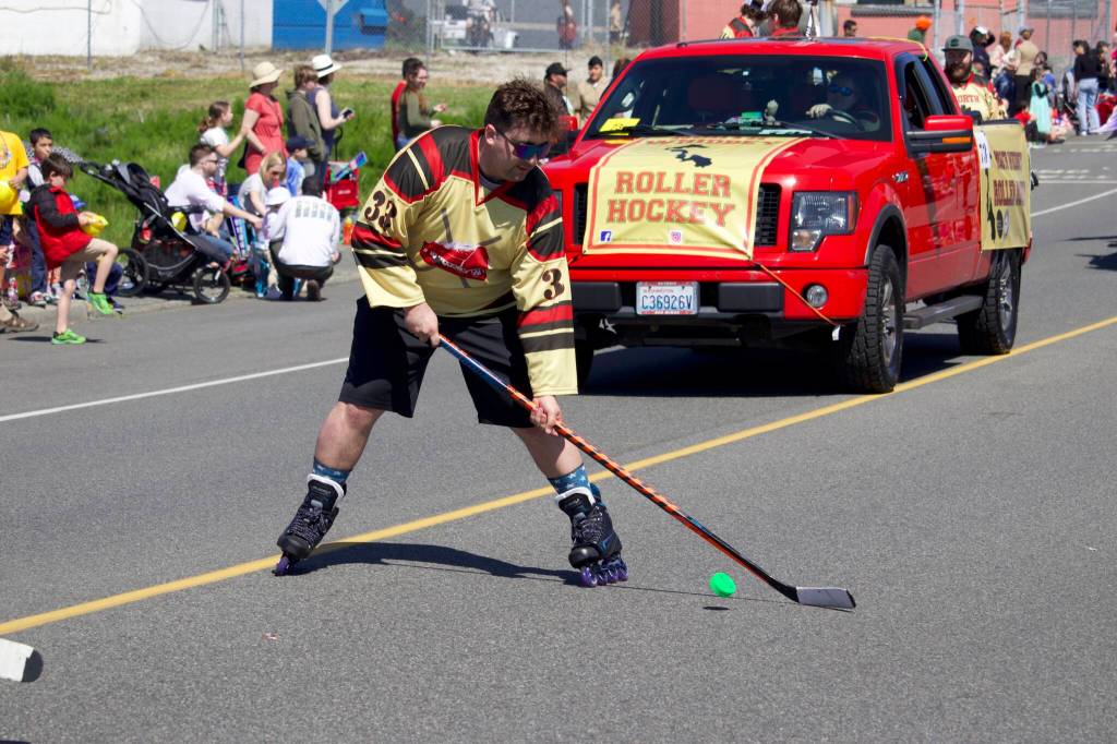 A member of Whidbey Islands rolller hockey team shoots a puck.