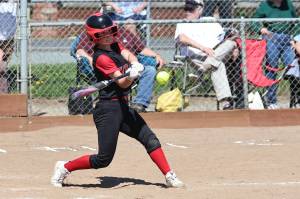 Photo by John Fisken
Haylee Armstrong, an eighth grader and starter on Coupeville High Schools varsity softball team, swings during a game against La Conner April 29. The Wolves won 17-2.