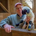Ken Leaman shows off one of the newest members of the flock. (Photo by David Welton)