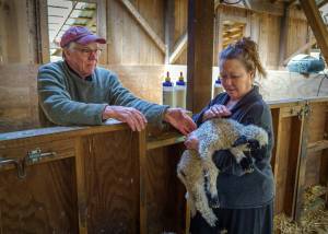 Photo by David Welton
Ken and Nan Leaman care for a 2-day-old lamb.