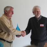 Photo by Karina Andrew/Whidbey News-Times
Joe Grogan, left, accepts the Grace Under Pressure award from state Department of Health representative Derek Pell.