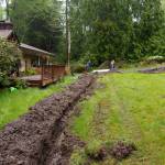 Volunteers at a Freeland job site dug an extensive trench, installing a drainage ditch.
