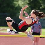 Sixth grader Tamsin Ward takes on the high jump. (Photo by John Fisken)
