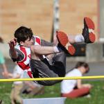 Seventh grader Johnathan Jacobsen competes in the high jump. (Photo by John Fisken)