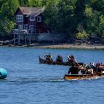 Photo by David Welton
Members of various Coast Salish tribes participate in canoe races at the Penn Cove Water Festival May 13. This years festival was the first since the beginning of the COVID-19 pandemic to hold the traditional canoe races.