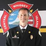 Longtime Central Whidbey Island Fire and Rescue firefighter Jerry Helm was sworn in as chief for the district at the fire station in Greenbank May 16. (Photo by Karina Andrew/Whidbey News-Times)
