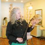 Alison Donham demonstrates what she calls fantasy hair, a blend of yarns that can be braided into someones hair as an accessory. (Photo by Kira Erickson/South Whidbey Record)