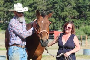 Photo by Karina Andrew/Whidbey News-Times
Doug and Alexis Mills stand with Django.