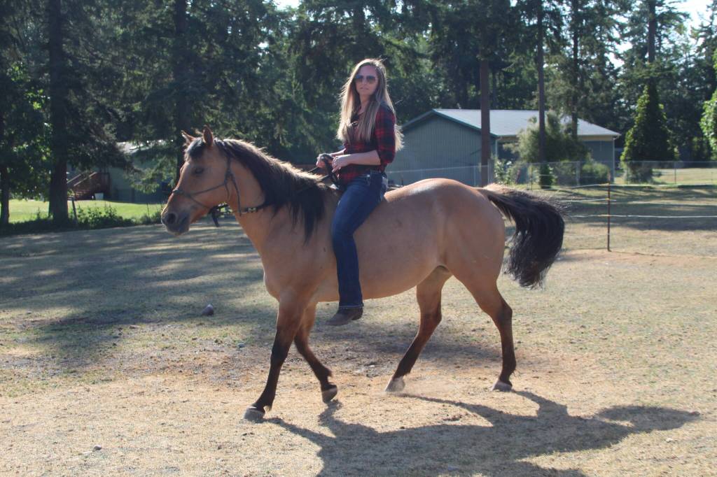 Photo by Karina Andrew/Whidbey News-Times
Shannon Ivins rides her horse, Apache.