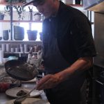 Photo by Karina Andrew/Whidbey News-Times
Ben Jones plates a meal at Oystercatcher.