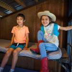 Kindergartener Aiden Rasmussen and second grader Athena Guerrero spend some time in the Cowboy Town jail. (Photo by David Welton)