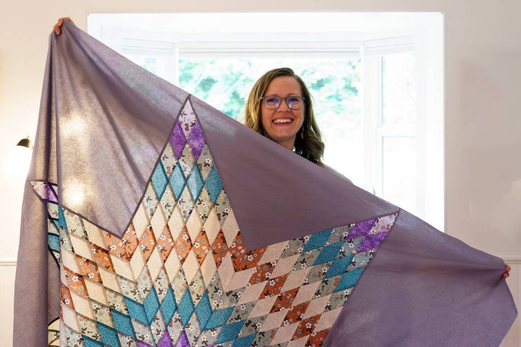 A quilter, Emily Grubb can make a blanket representing the couples colors for their wedding. (Photo by David Welton)