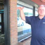 Public Works Director Steve Schuller shows a city-owned building on Pioneer Way that has fallen into disrepair. (Photo by Karina Andrew/Whidbey News-Times)