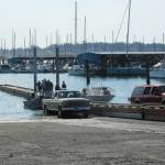 Crabbers prepare to pull their boats out of the water with the help of the new ramp float. (Photo by Luisa Loi)