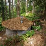 Wood chips line the roof of another natural structure Eli Adadow is building. (Photo by David Welton)