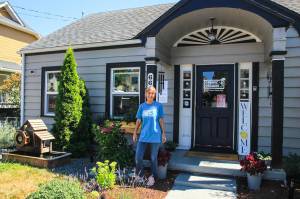 Larsen poses in front of her new business. (Photo by Luisa Loi)