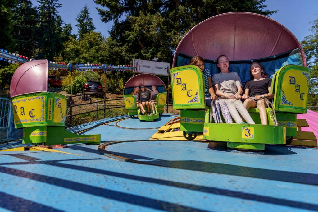 Carnival rides whirred into dizzying motion Thursday afternoon. (Photo by David Welton)