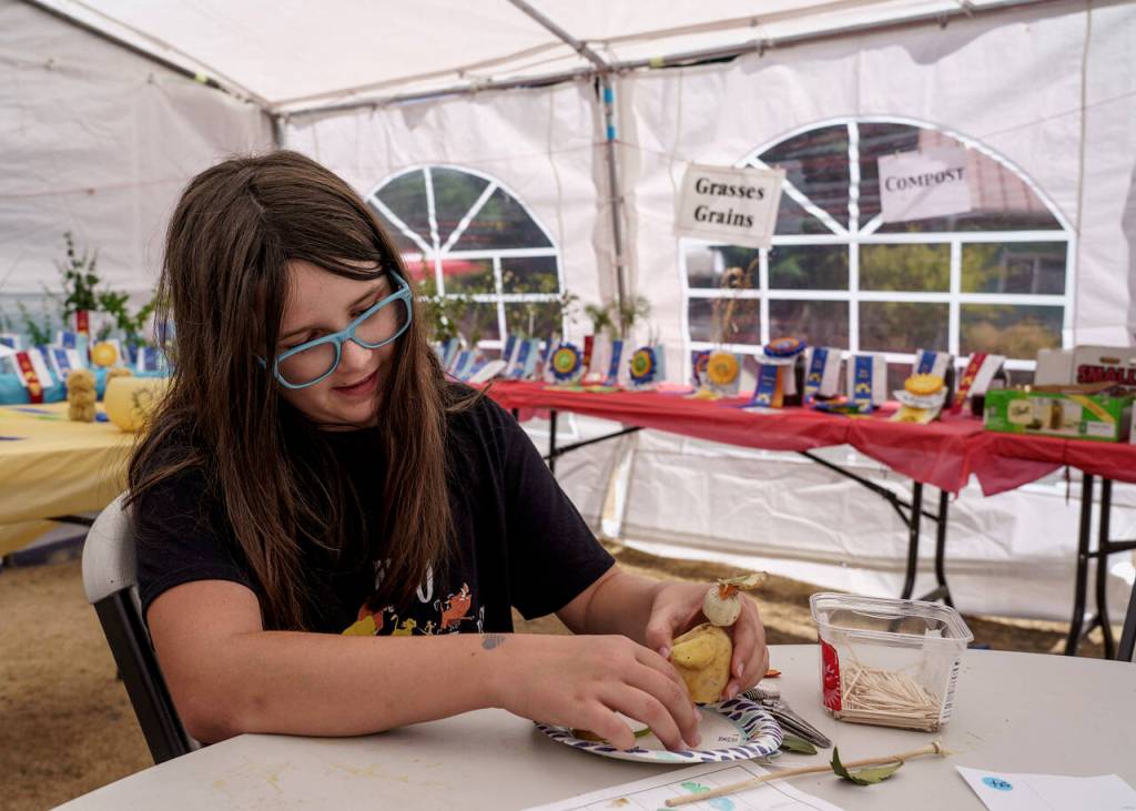Oak Harbor resident Shiloh Burlingame, 11, puts together a veggie critter. (Photo by David Welton)