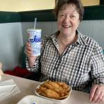 Deb, Eric Arnolds wife, enjoys some free fish and chips courtesy of Ivars. (Photo provided)