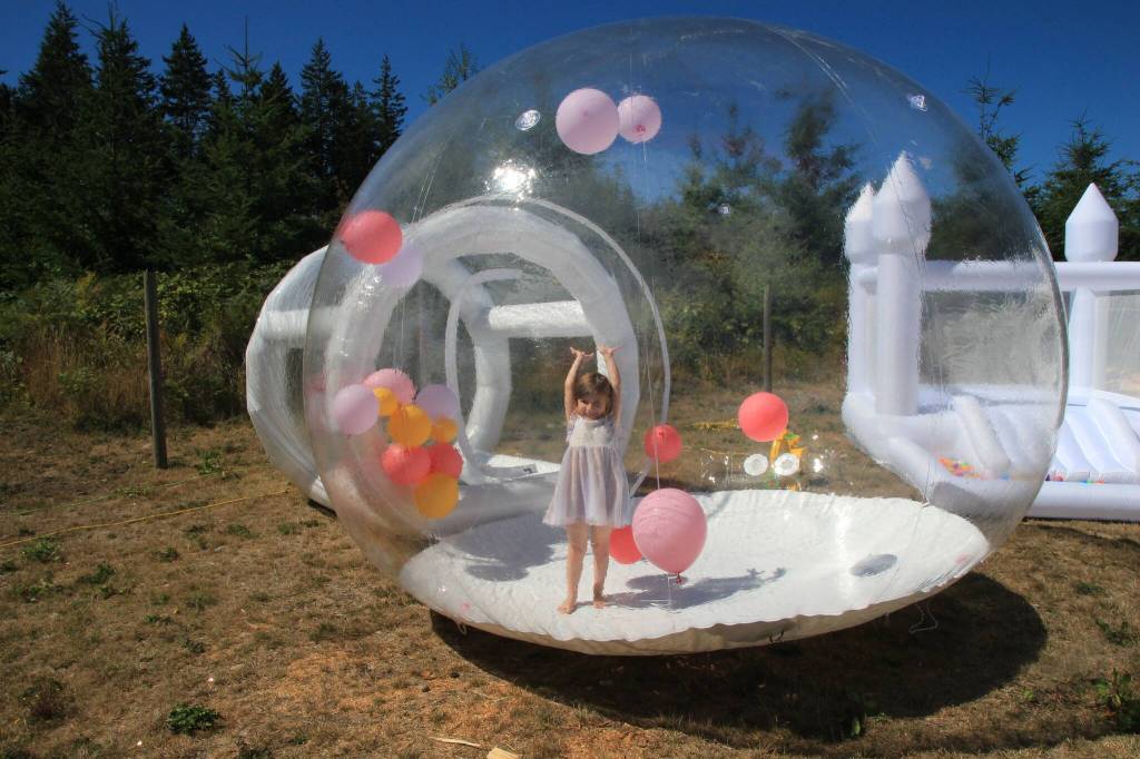 Teagan has fun playing in the Bubble Inflatable.