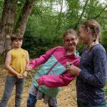 Photo by David Welton
From left, cousins Gus Black, 7, from Seattle, Katie Olin, 7, from Lynnwood and Sally Gibbs, 8, from Edmonds play in the woods at Full Moon Rising Farm.