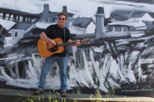 Photo by Karina Andrew/Whidbey News-Times
Larry Mason plays guitar in downtown Oak Harbor.
