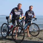 Photo by Karina Andrew/Whidbey News-Times
Cyclists dip their tires in the Salish Sea.